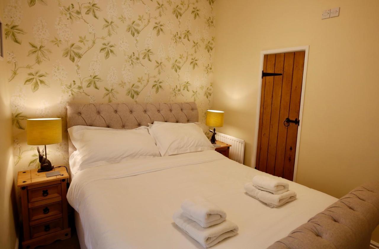 Ashfield House Hotel Grassington Ruang foto A bedroom at the Old Post Office